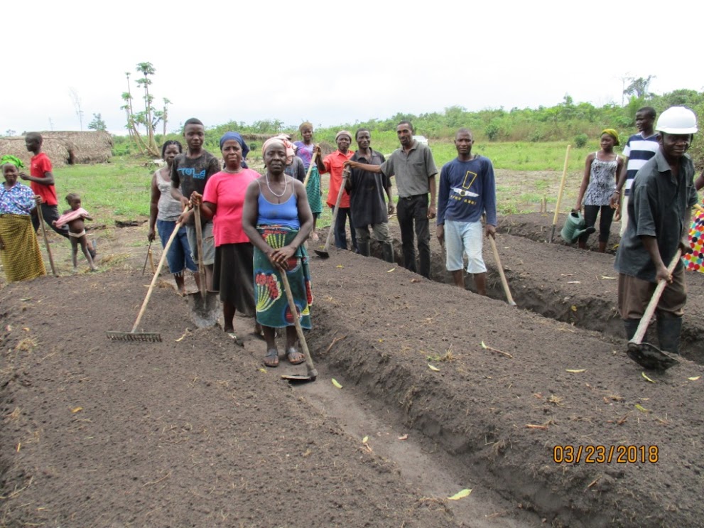 Workshop Day 3 teaching farmers how to prepare the soil. They learn how to compost, how to rotate crops, how to add nutrients. Later they learn how to plant seeds. Some seedlings need the shelter of a nursery. So they built nurseries.