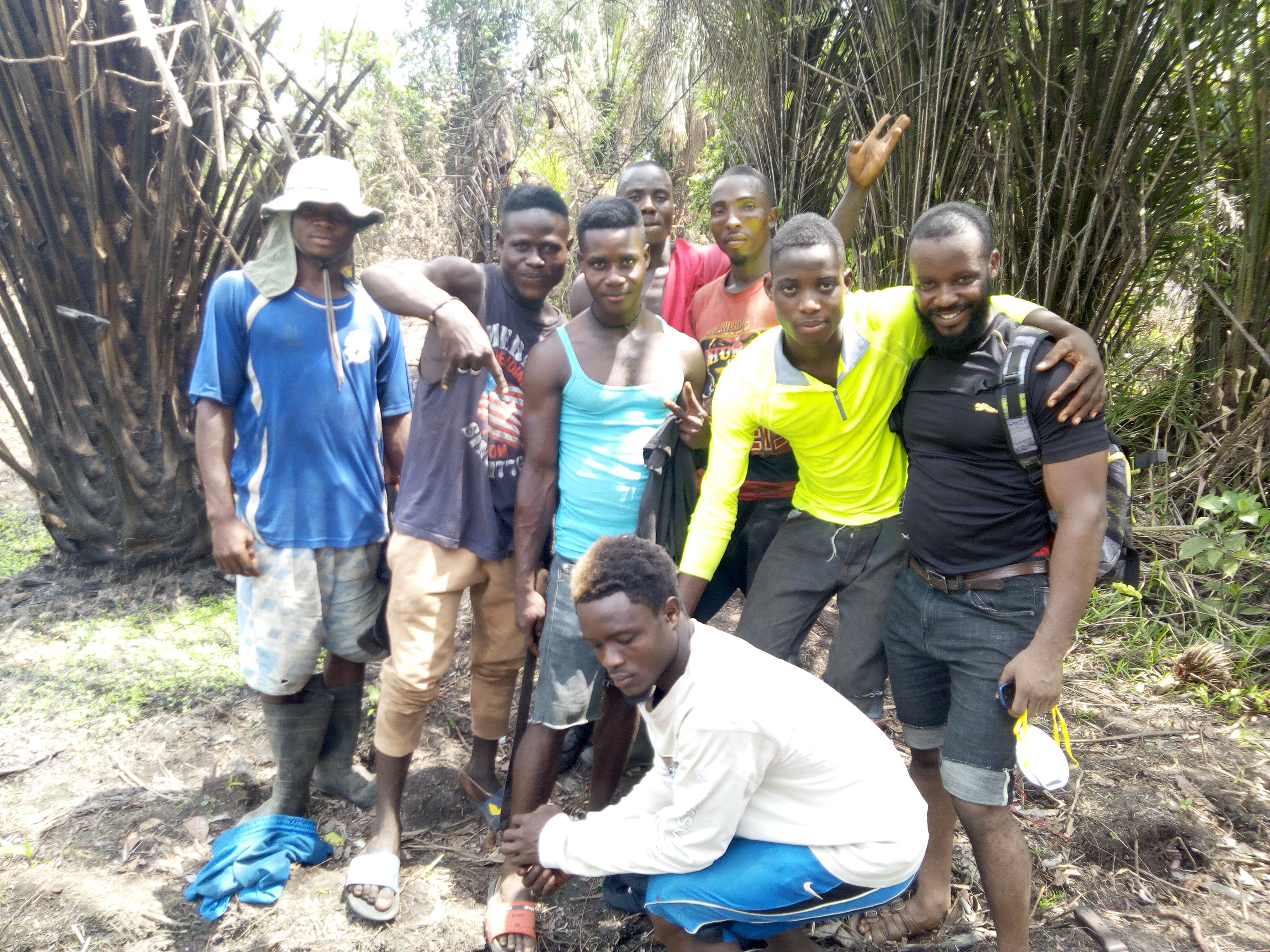 This is a photo of some of the local workers hired to help clear land and help carry bamboo poles to build the nursery.