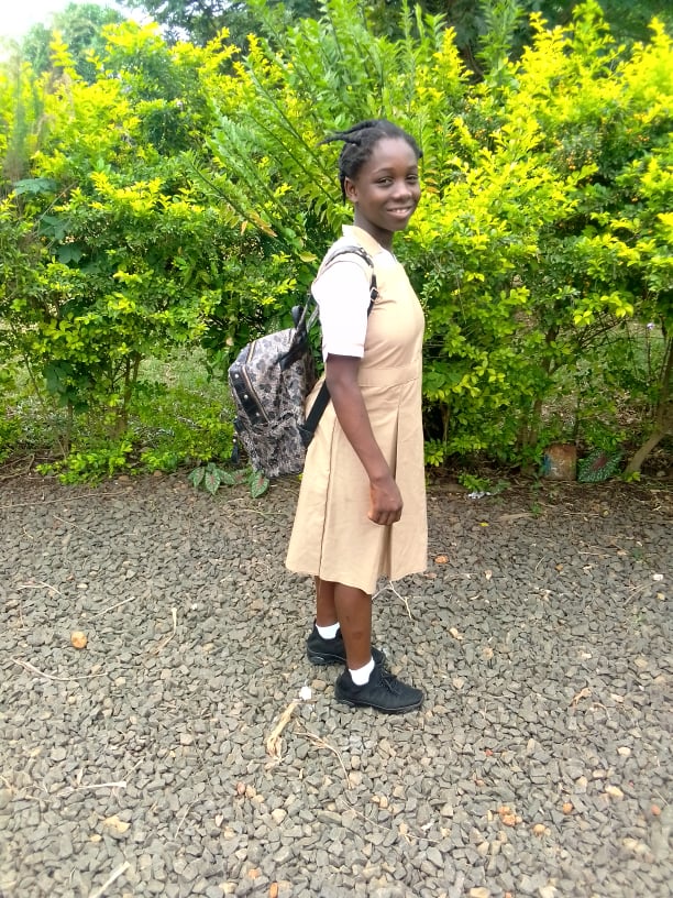 Princess is so grateful to be attending school!  She has a new uniform, black shoes and a book bag.
