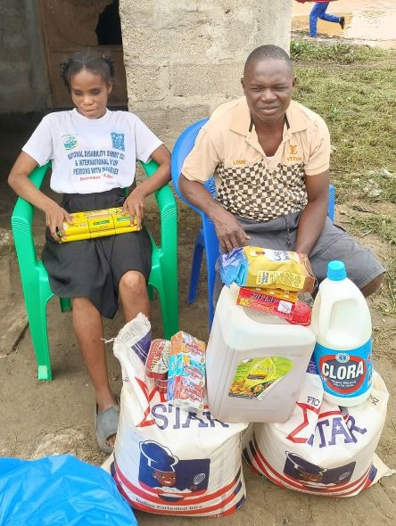 Princess Kollie's blind parents receive food for Christmas. They are so very grateful!