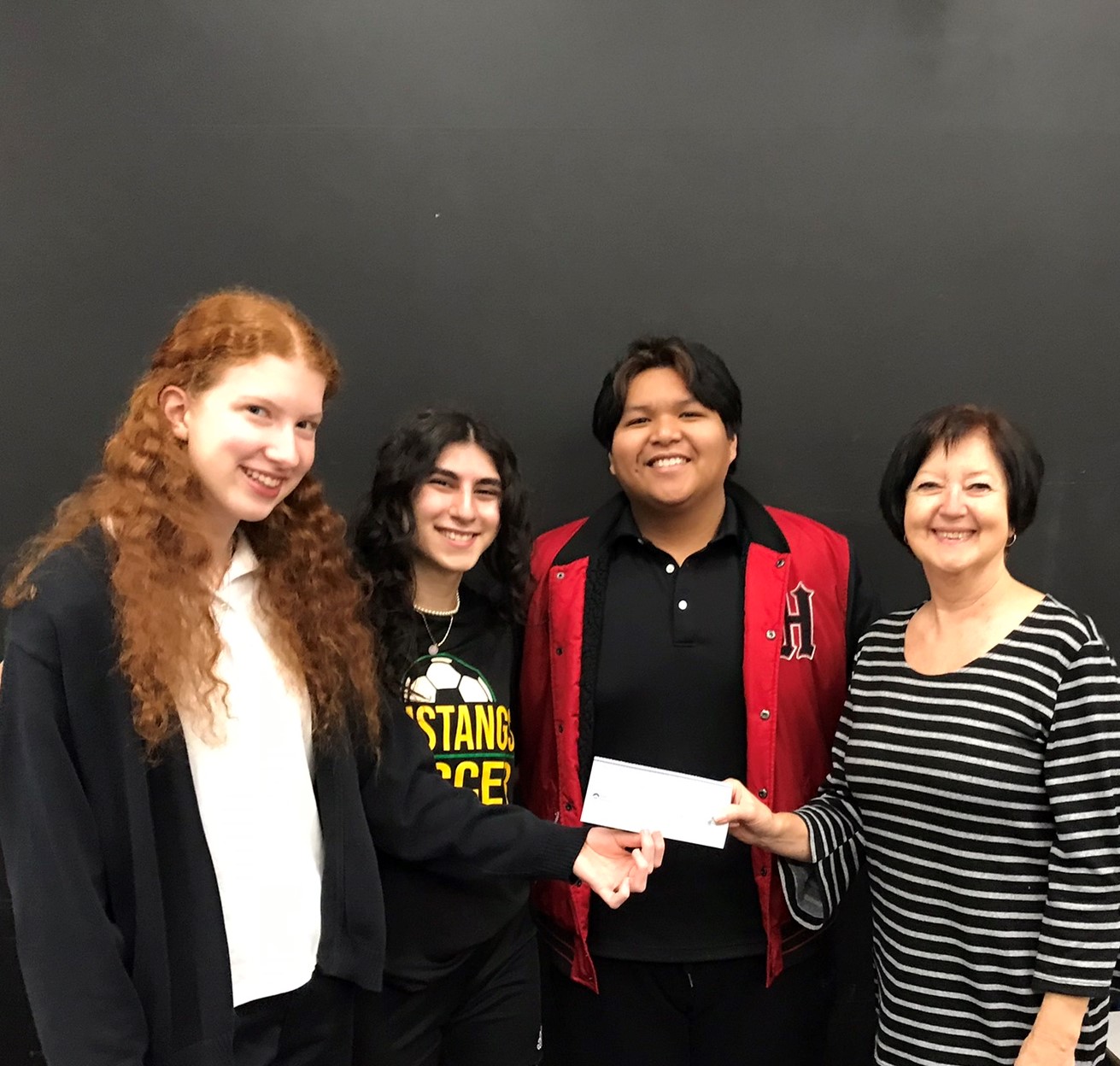 Immaculata Team presents prize money to Karen Barkman, Provision of Hope. We have already started the first project that this money was designated for. How exciting!