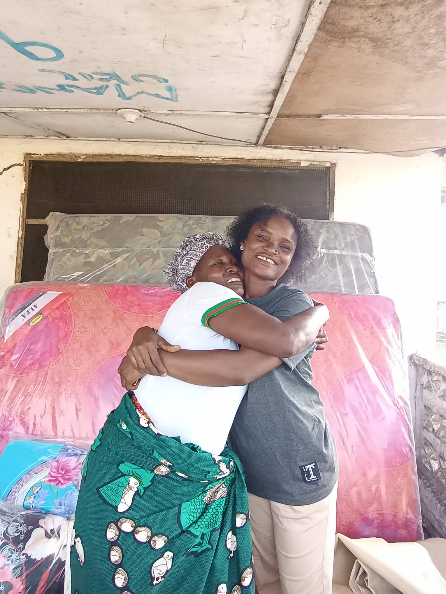 Fanny gives Bernice a big hug!  She is so thankful that Bernice connected her to Provision of Hope. 
Fanny is so grateful that she has this beautiful place and has all her children with her again.