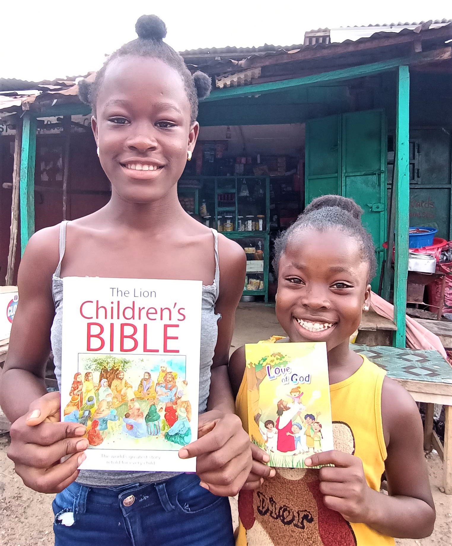 Ruth and Favor are so happy for their Children's Bible and Love of God Story Book!
