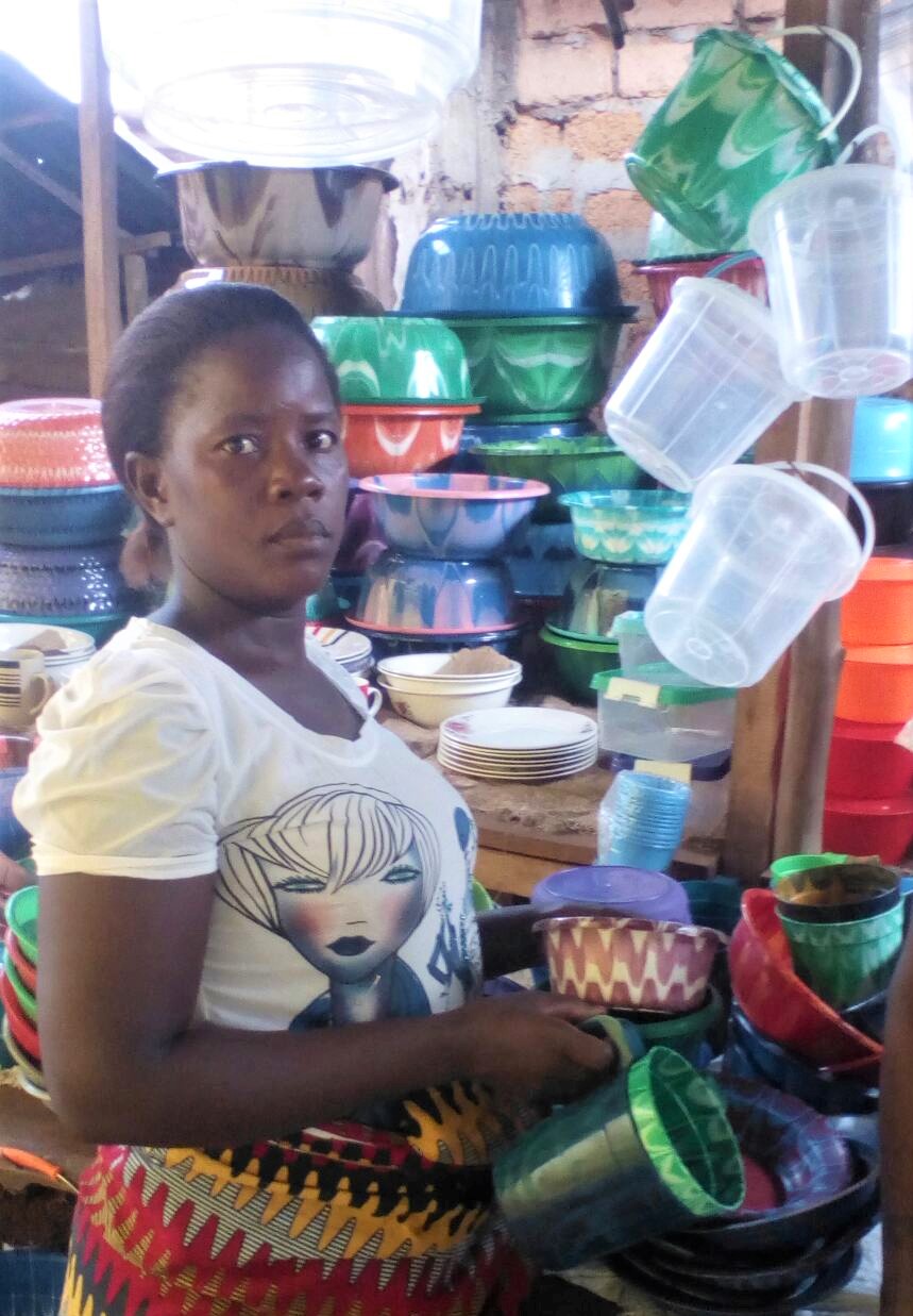 Ruth sells plastic dishes at the market.