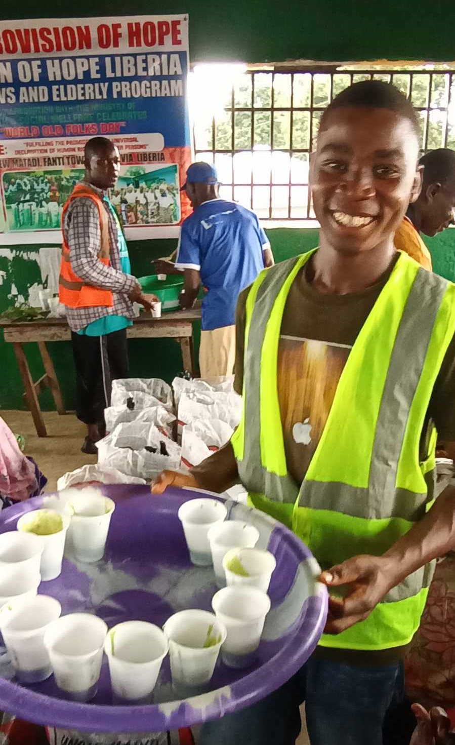 Jeremiah Karr is one of our volunteers handing out the moringa drinks.