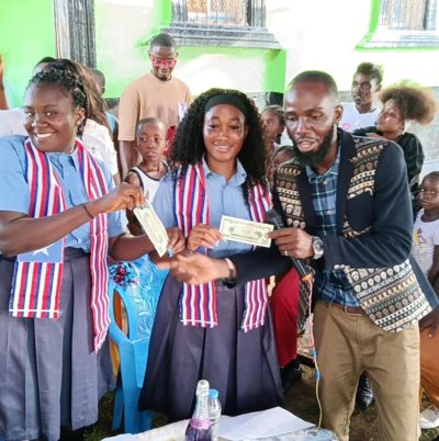 Daniel presents scarves and money