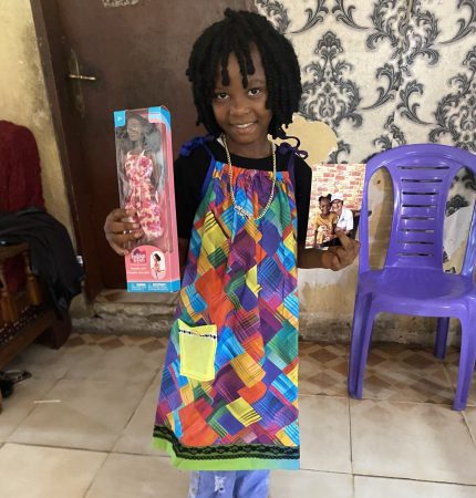 Marie with her new Barbie doll and sundress