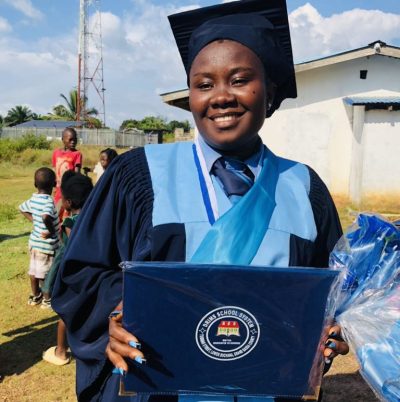 Ruth holding her diploma
