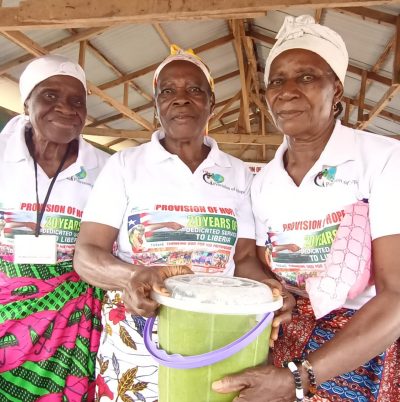 Widows smiling with moringa